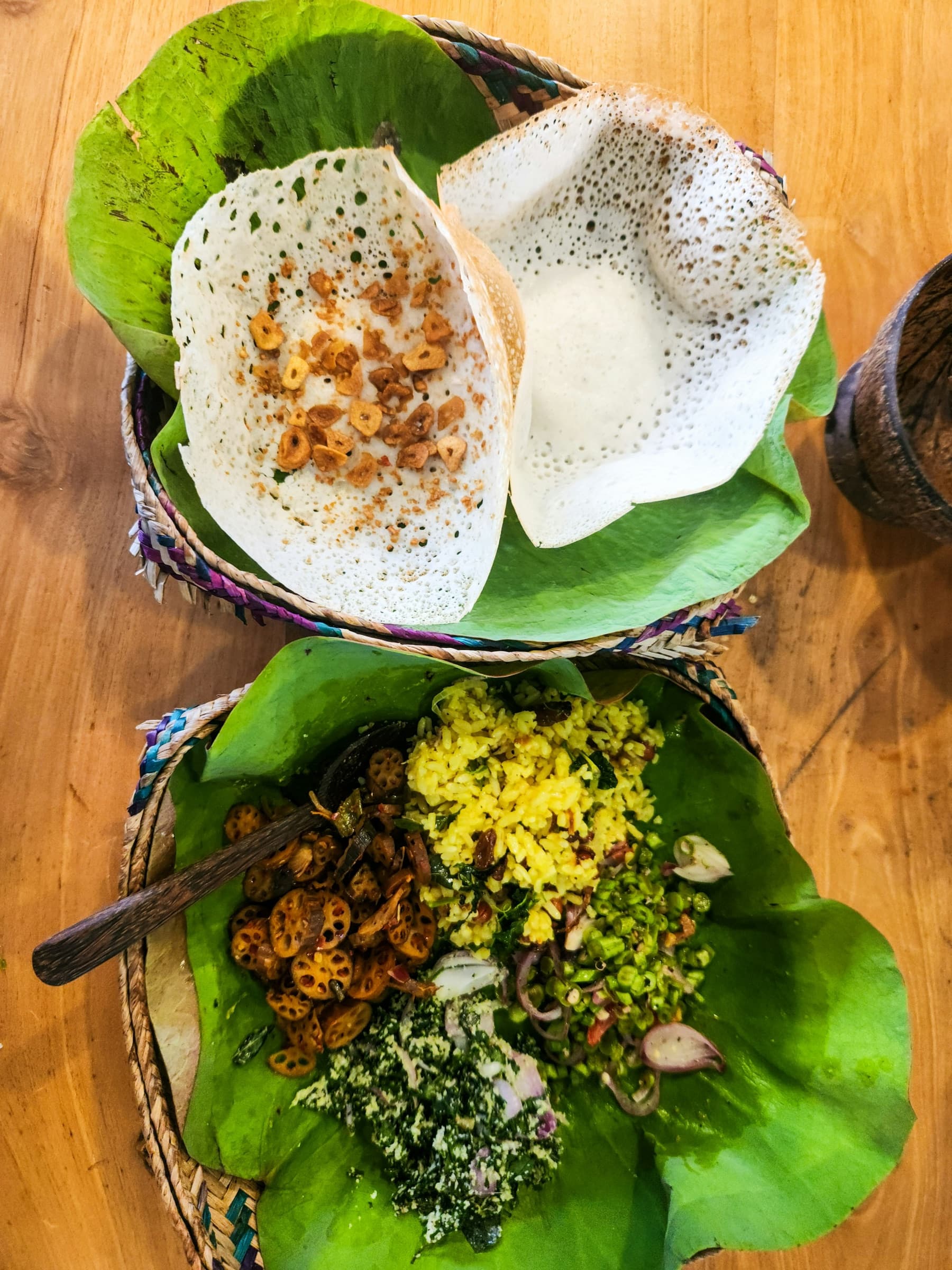 Sri Lankan hoppers and breakfast dishes served in woven baskets