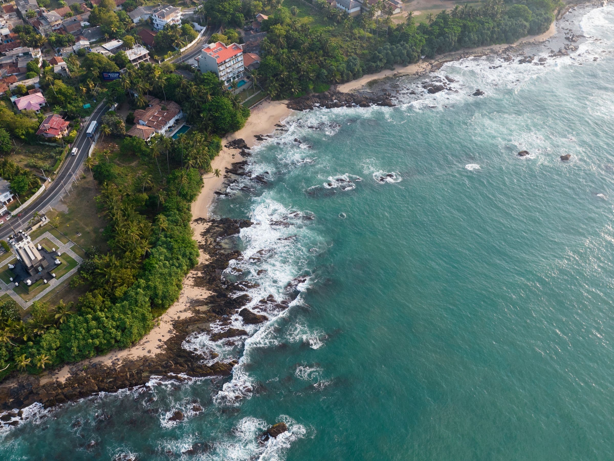 Aerial view of Tangalle’s palm-lined coastline and Indian Ocean